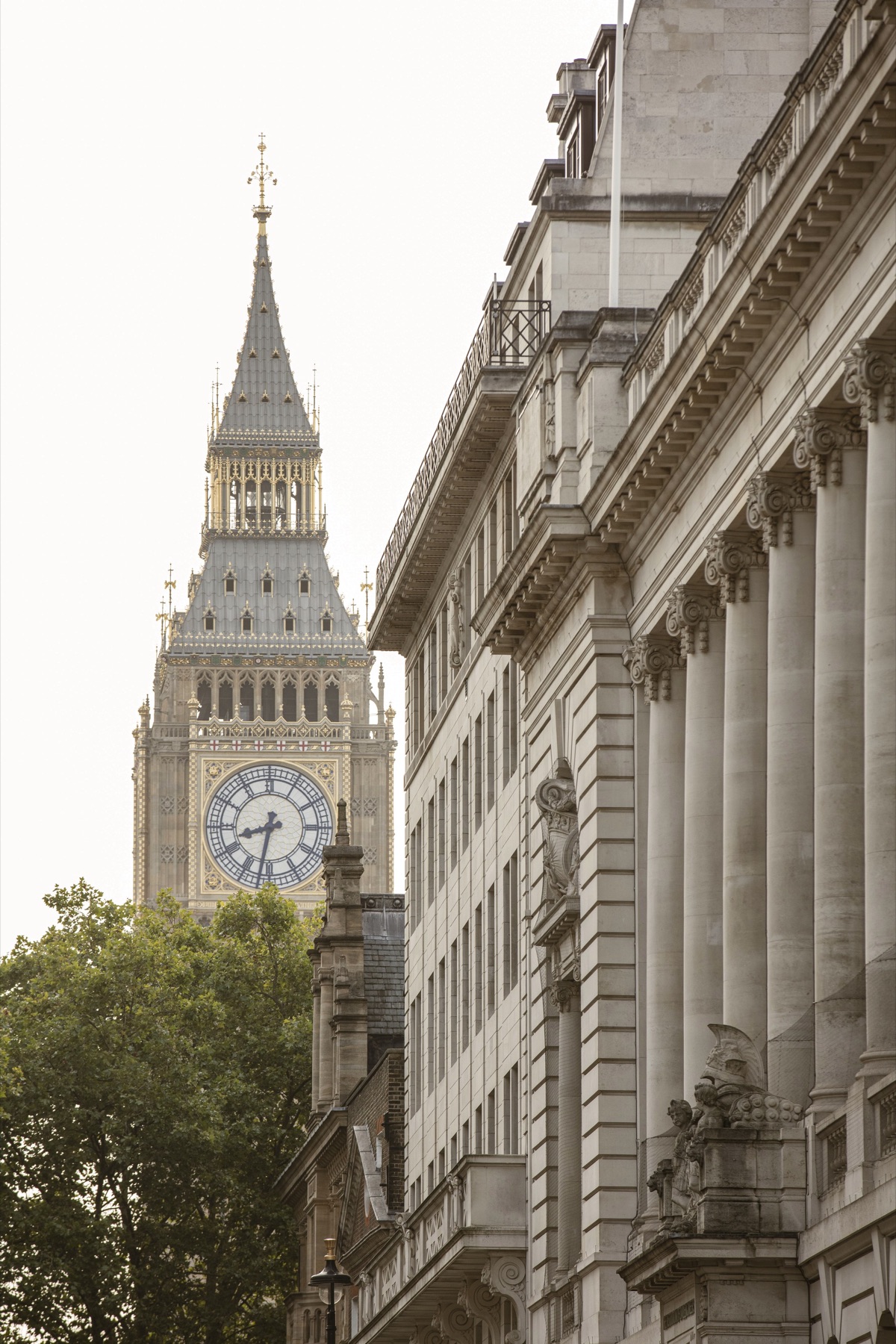 Big Ben seen down a grand stone street in Westminster, London